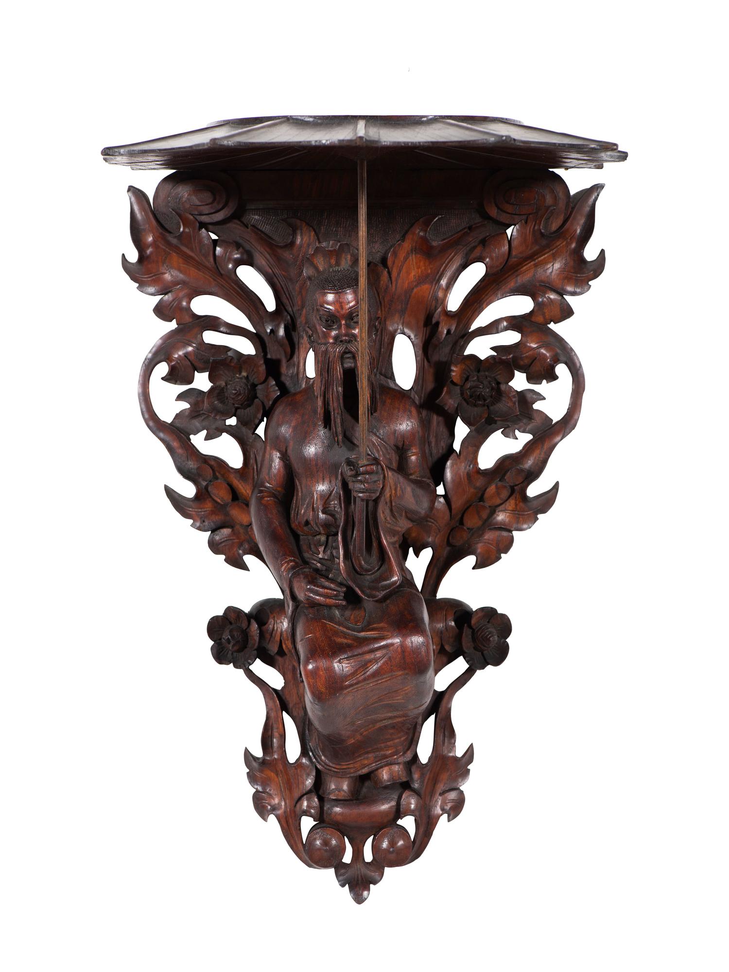 A Pair of Carved Oak Figural Wall Brackets