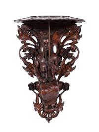 A Pair of Carved Oak Figural Wall Brackets