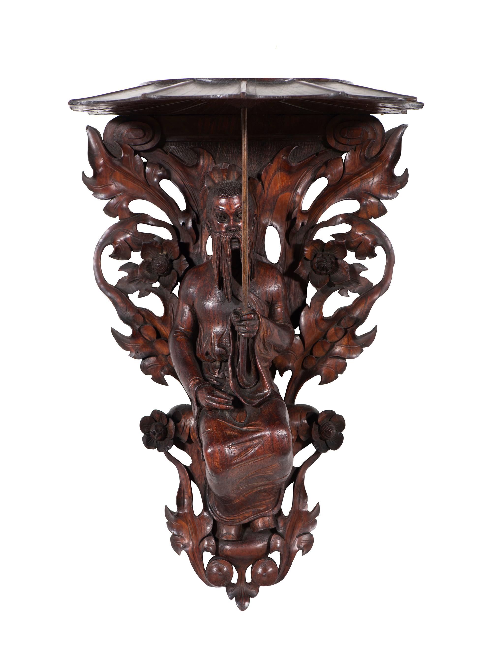 A Pair of Carved Oak Figural Wall Brackets