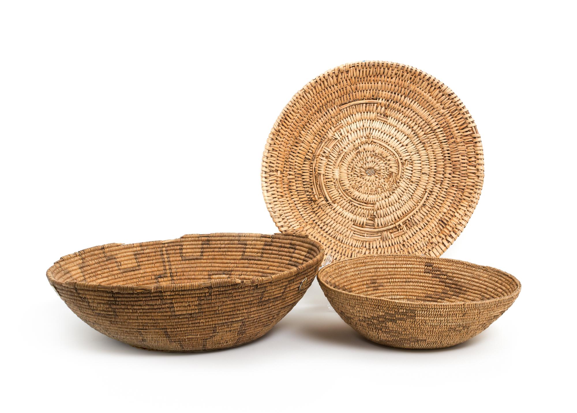Seven Navajo/ Jicarilla Area Baskets Height of largest 4 x diameter 15 inches.