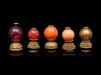 A Chinese Russet Jade Archer's Ring and Ten Chinese Hardstone and Gilt Bronze Hat Finials