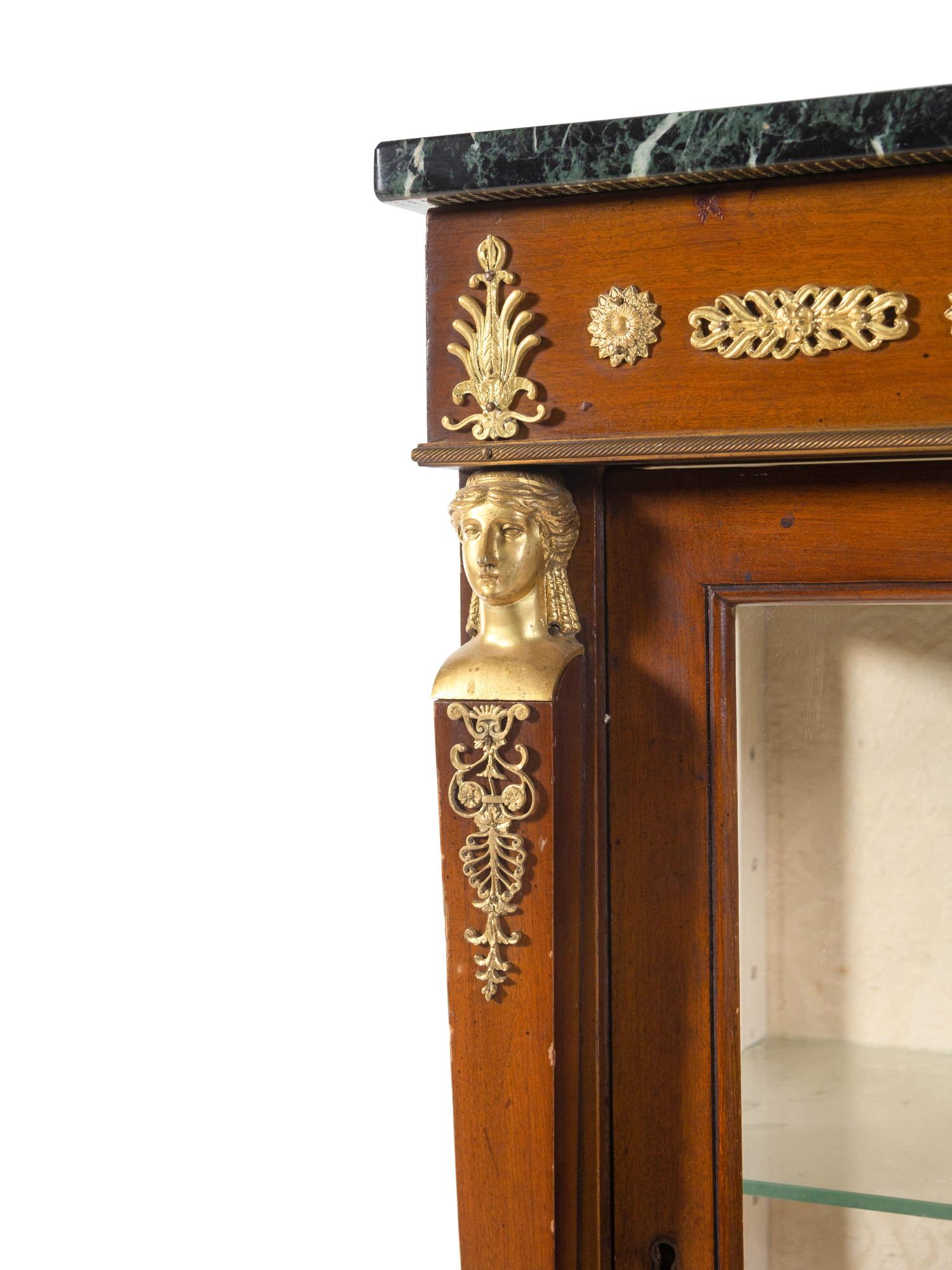 An Empire Style Gilt Bronze Mounted Mahogany Marble-Top Vitrine Cabinet