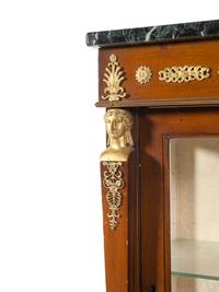 An Empire Style Gilt Bronze Mounted Mahogany Marble-Top Vitrine Cabinet