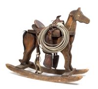 A Buck-a-Roo Style Rocking Horse Height 36 1/2 x width 14 1/2 x depth 42 3/4 inches.