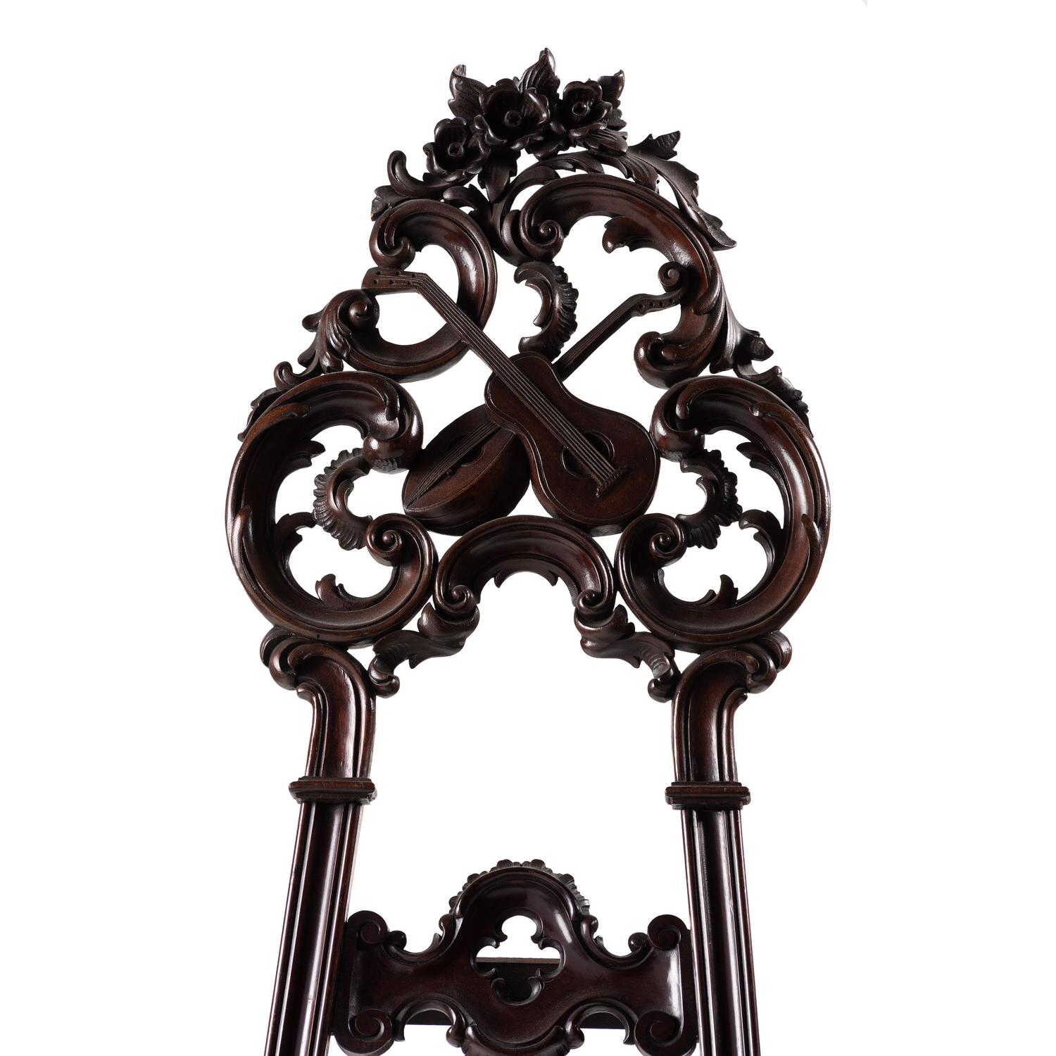 A Renaissance Revival Carved Walnut Musical Easel