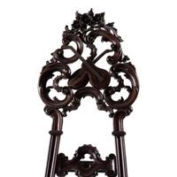 A Renaissance Revival Carved Walnut Musical Easel