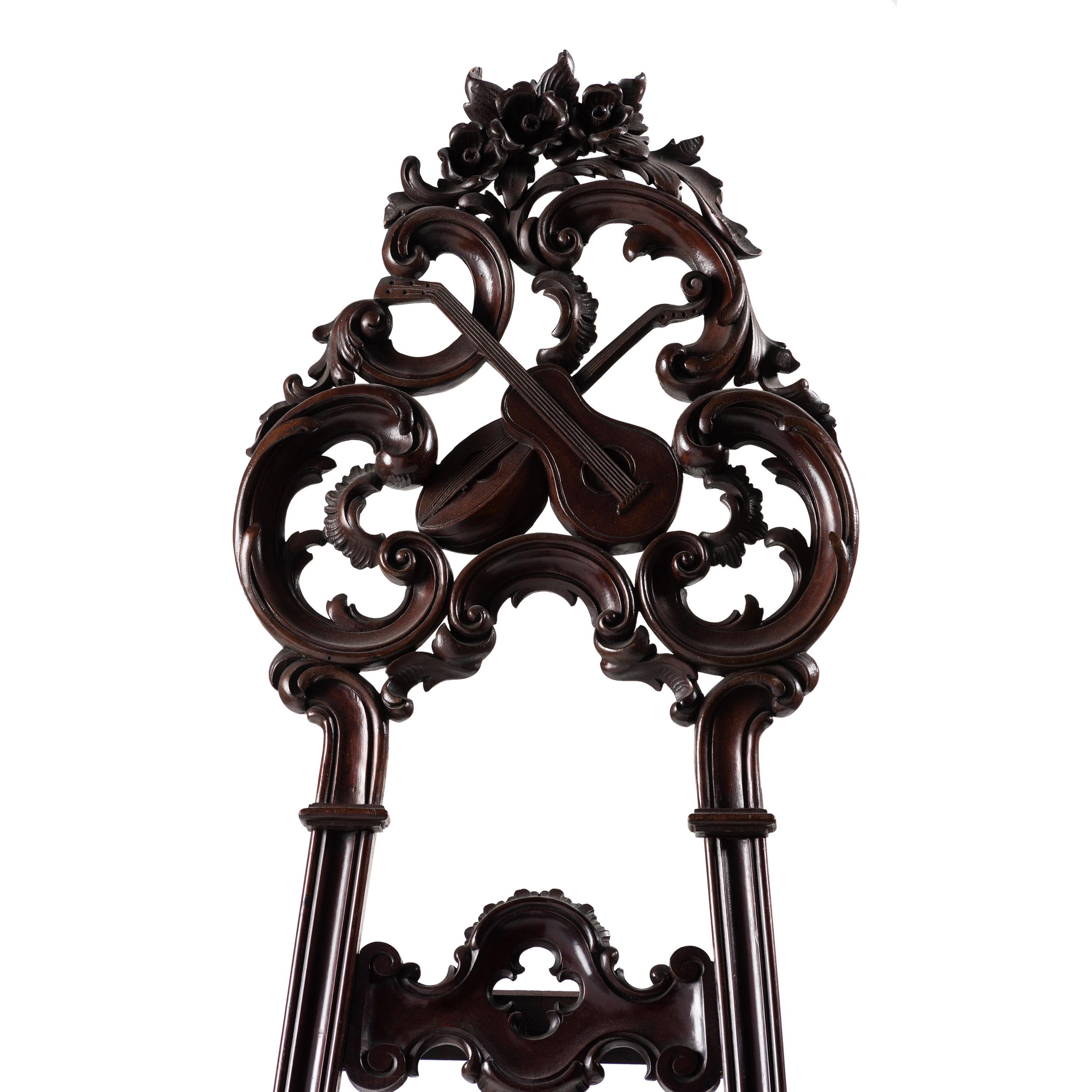 A Renaissance Revival Carved Walnut Musical Easel