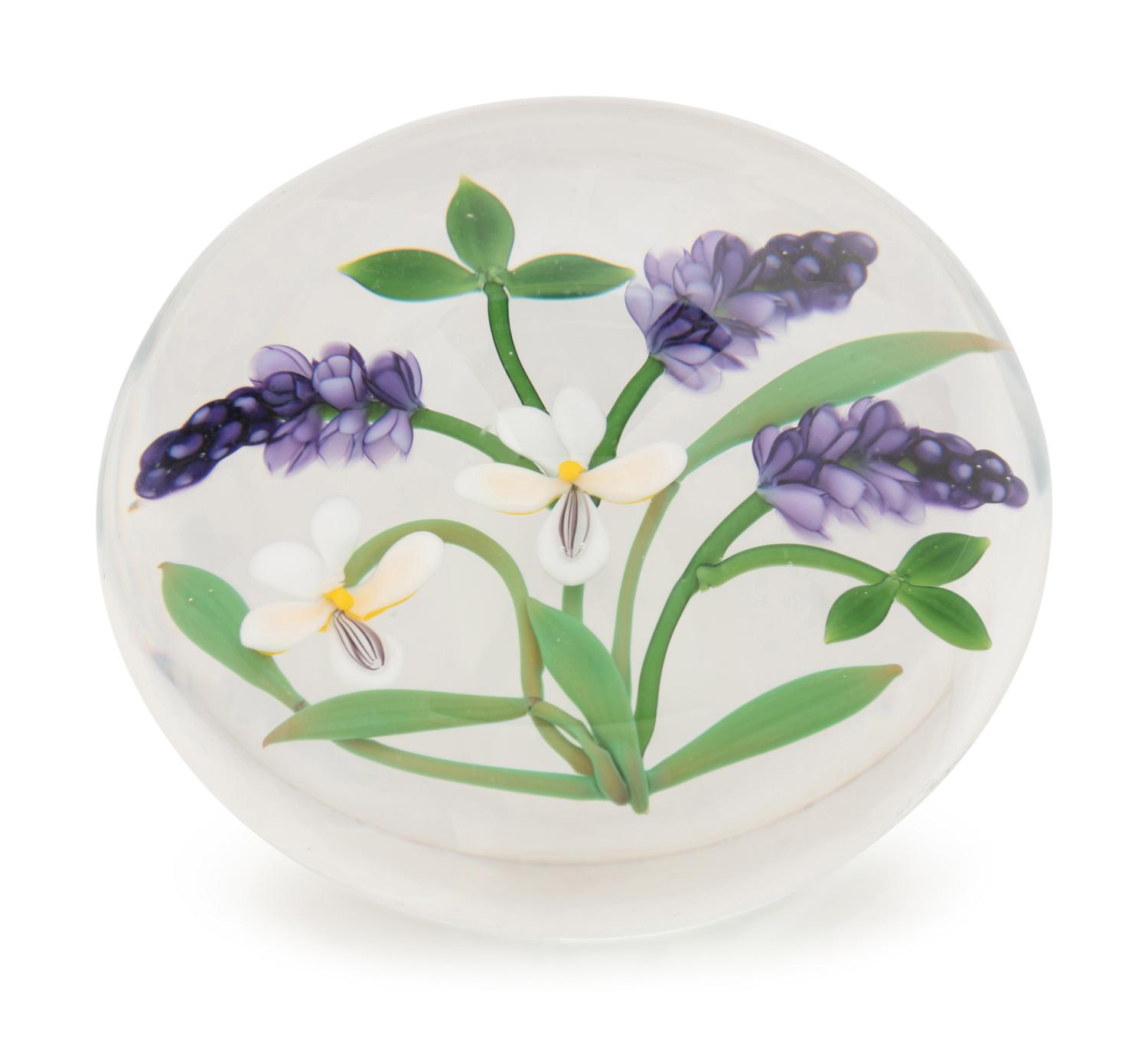 A Chris Buzzini Three Lavender Spears and Two White Flowers Glass Paperweight