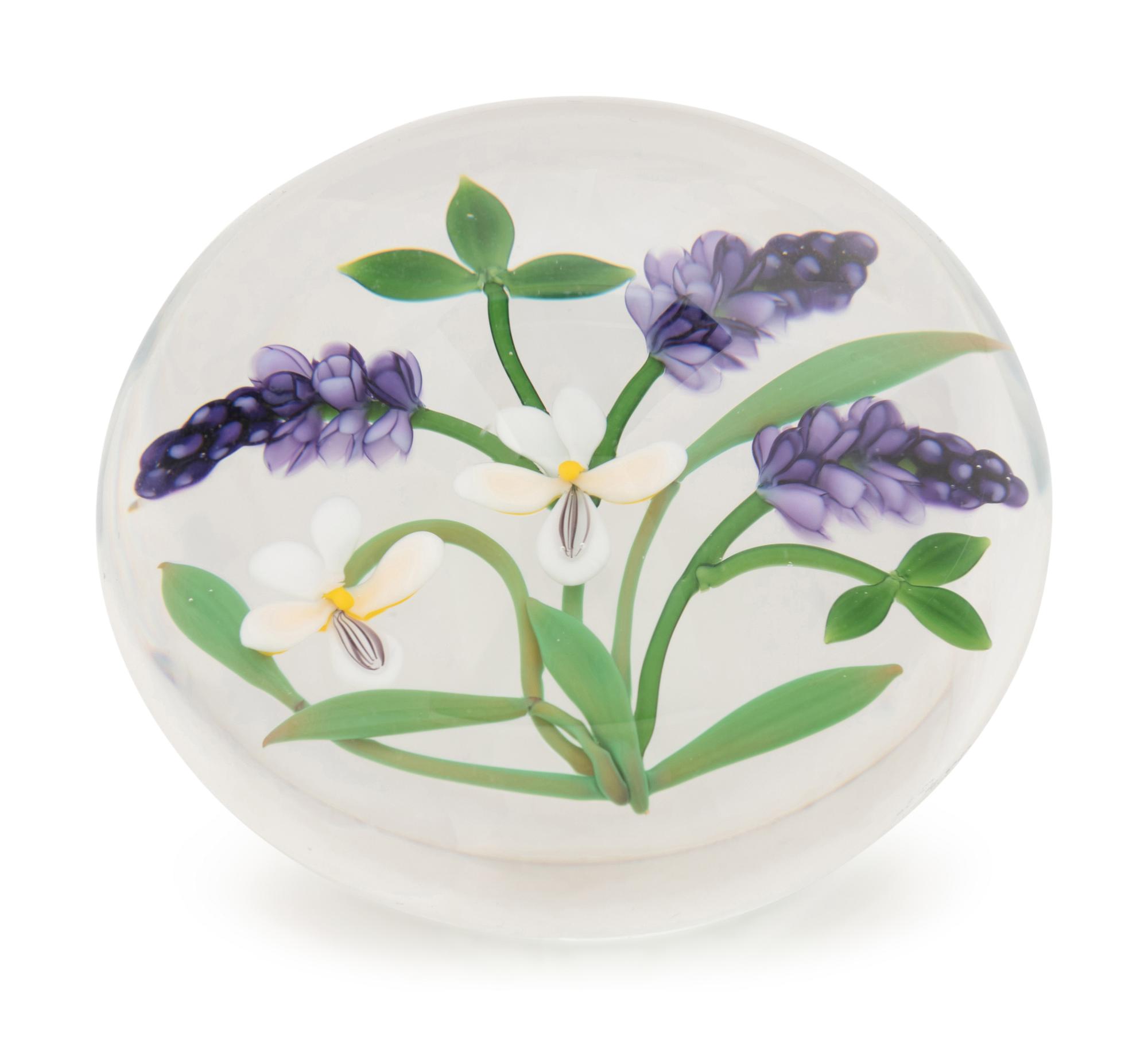 A Chris Buzzini Three Lavender Spears and Two White Flowers Glass Paperweight