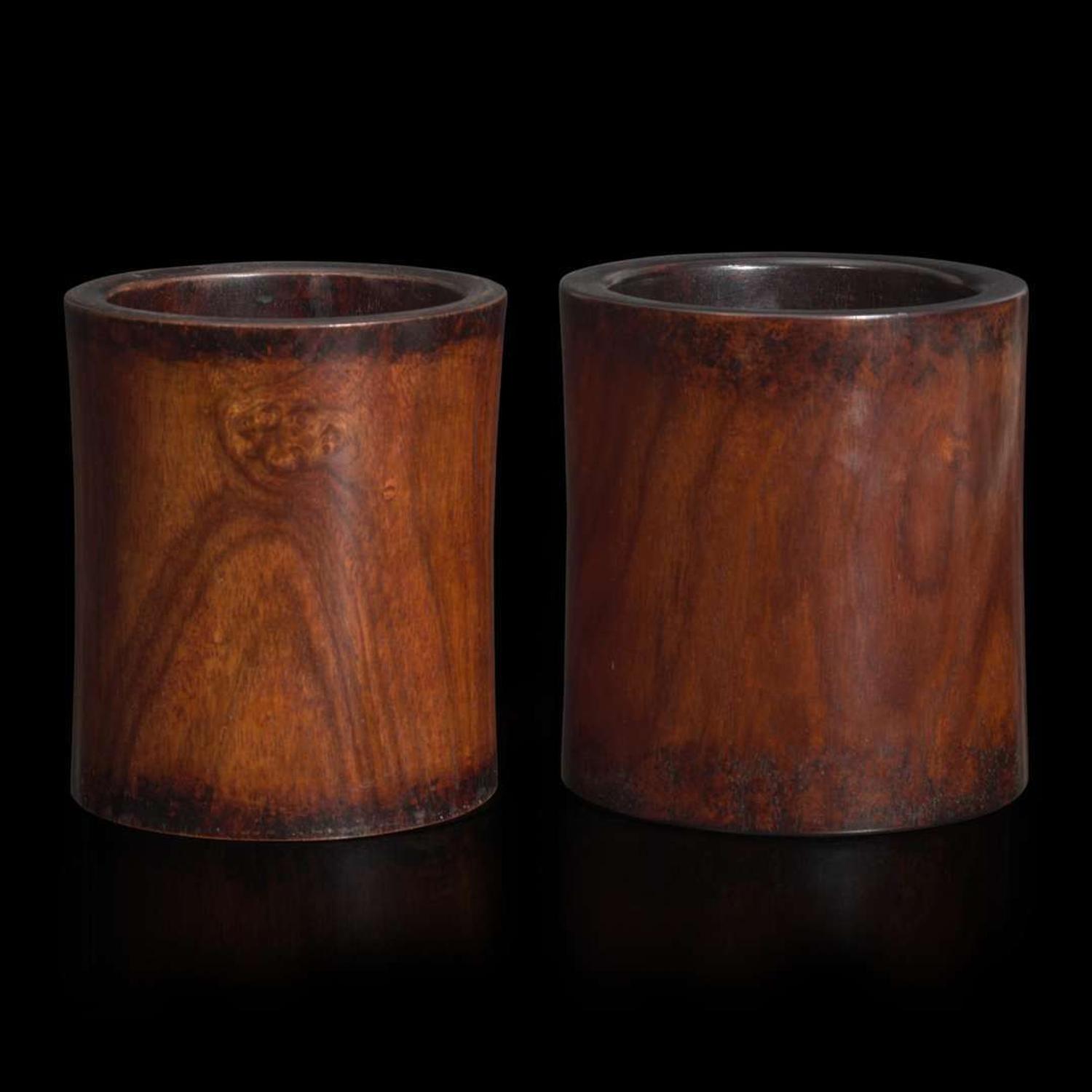 Two Chinese “huanghuali” brush pots 黄花梨笔筒两件