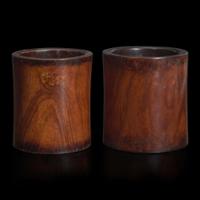 Two Chinese “huanghuali” brush pots 黄花梨笔筒两件