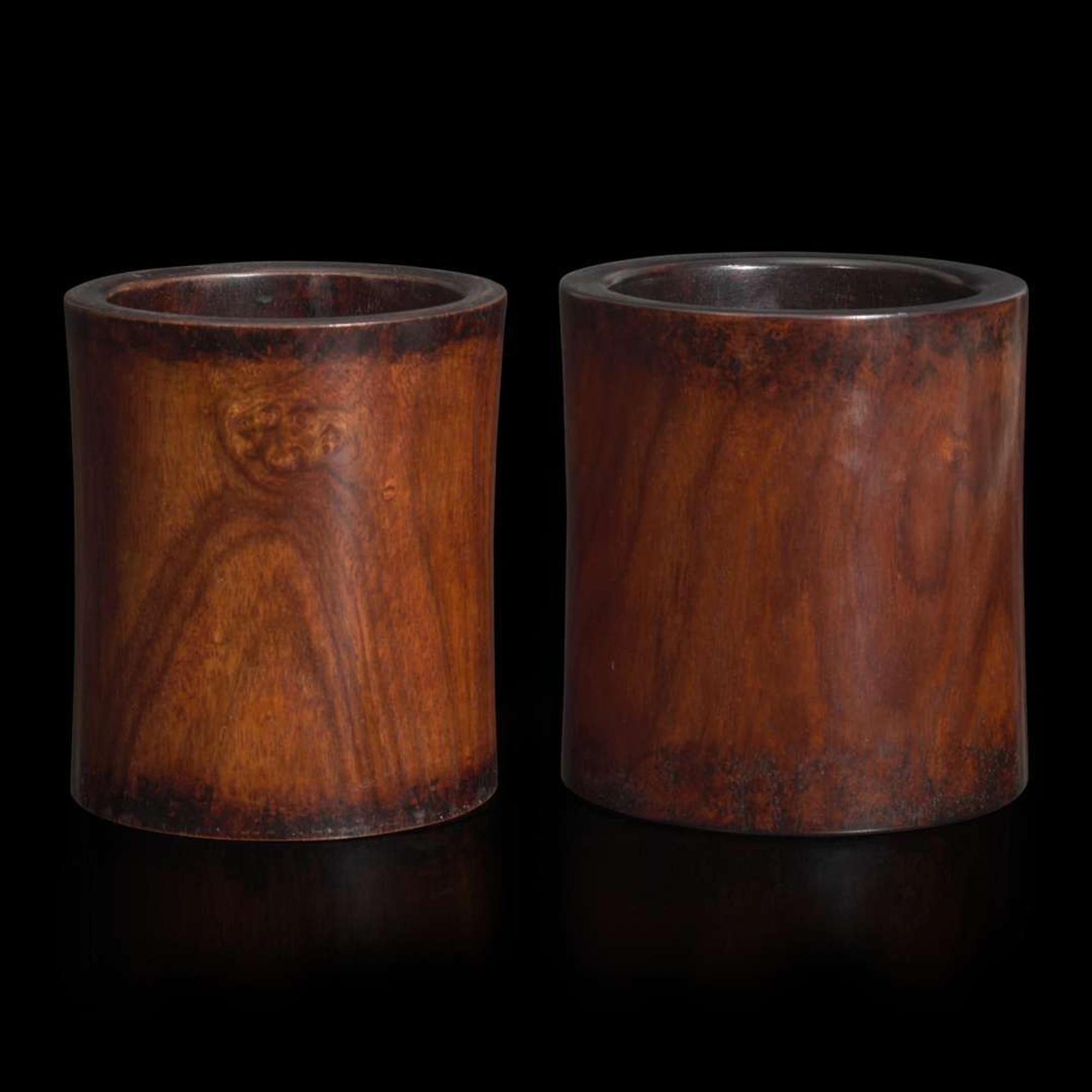 Two Chinese “huanghuali” brush pots 黄花梨笔筒两件