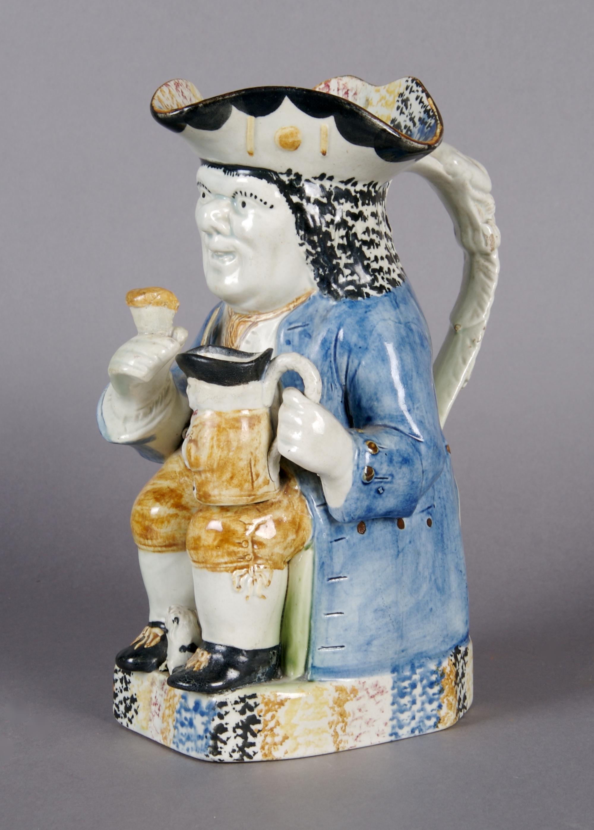An English Prattware Toby Jug, Height 9 3/4 inches.