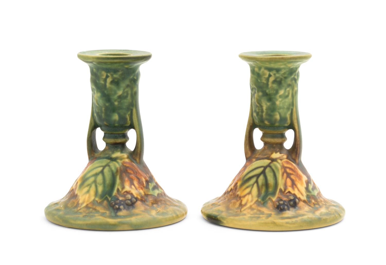 A Pair of Roseville Blackberry Pottery Candlesticks Height 4 1/2 inches.