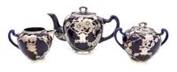 A Lenox Porcelain Silver Overlay Partial Tea Service Height of teapot 5 5/8 inches.
