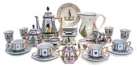 A Collection of Quimper Pottery Tea and Coffee Articles Height of coffee pot 9 1/2 inches.