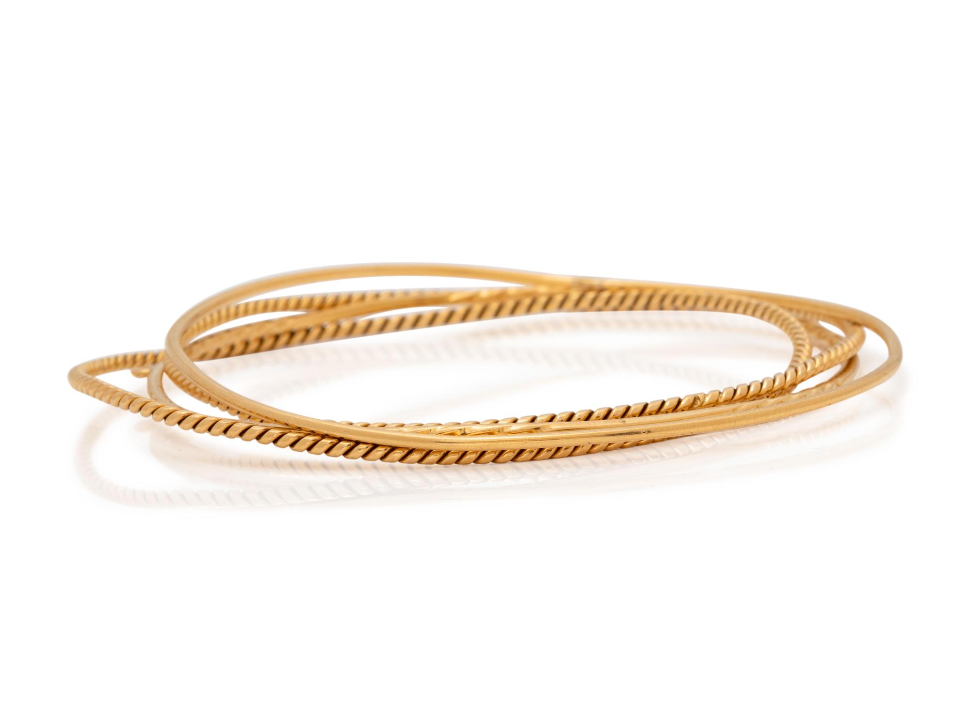 A Collection of Yellow Gold Bangle Bracelets,