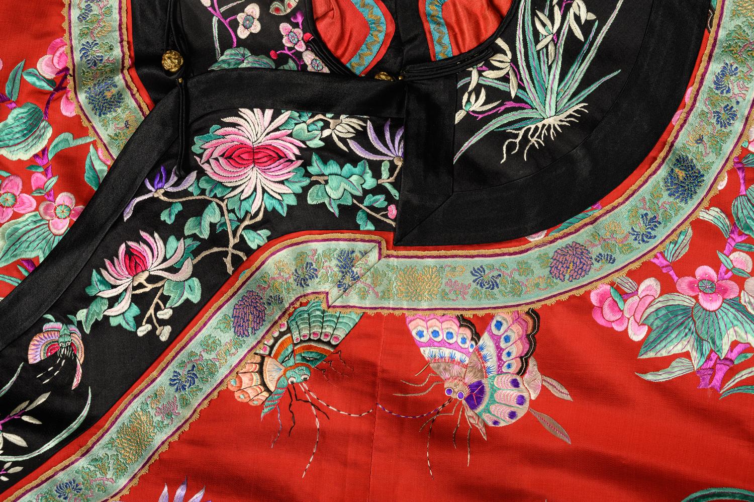 A Red Ground Embroidered Silk Manchu Lady's Robe