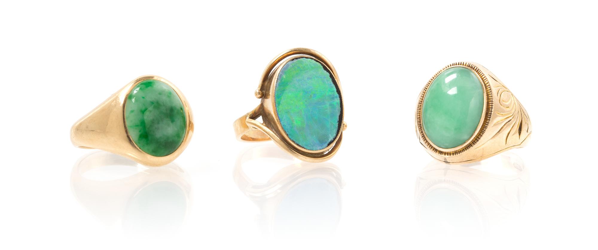 A Collection of Yellow Gold, Jade and Opal Rings, 12.60 dwts.