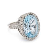 BLUE TOPAZ, DIAMOND, AND WHITE GOLD RING