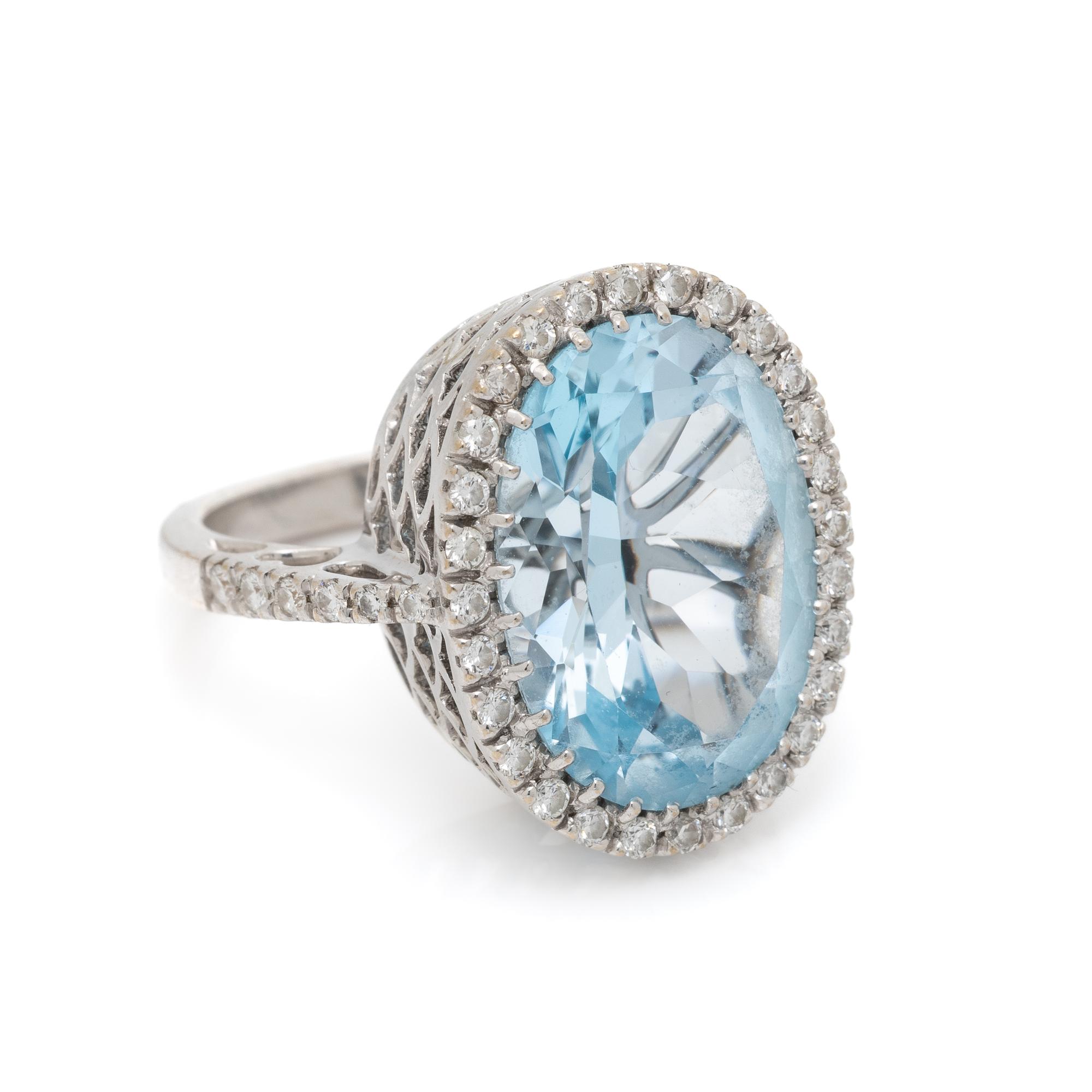 BLUE TOPAZ, DIAMOND, AND WHITE GOLD RING