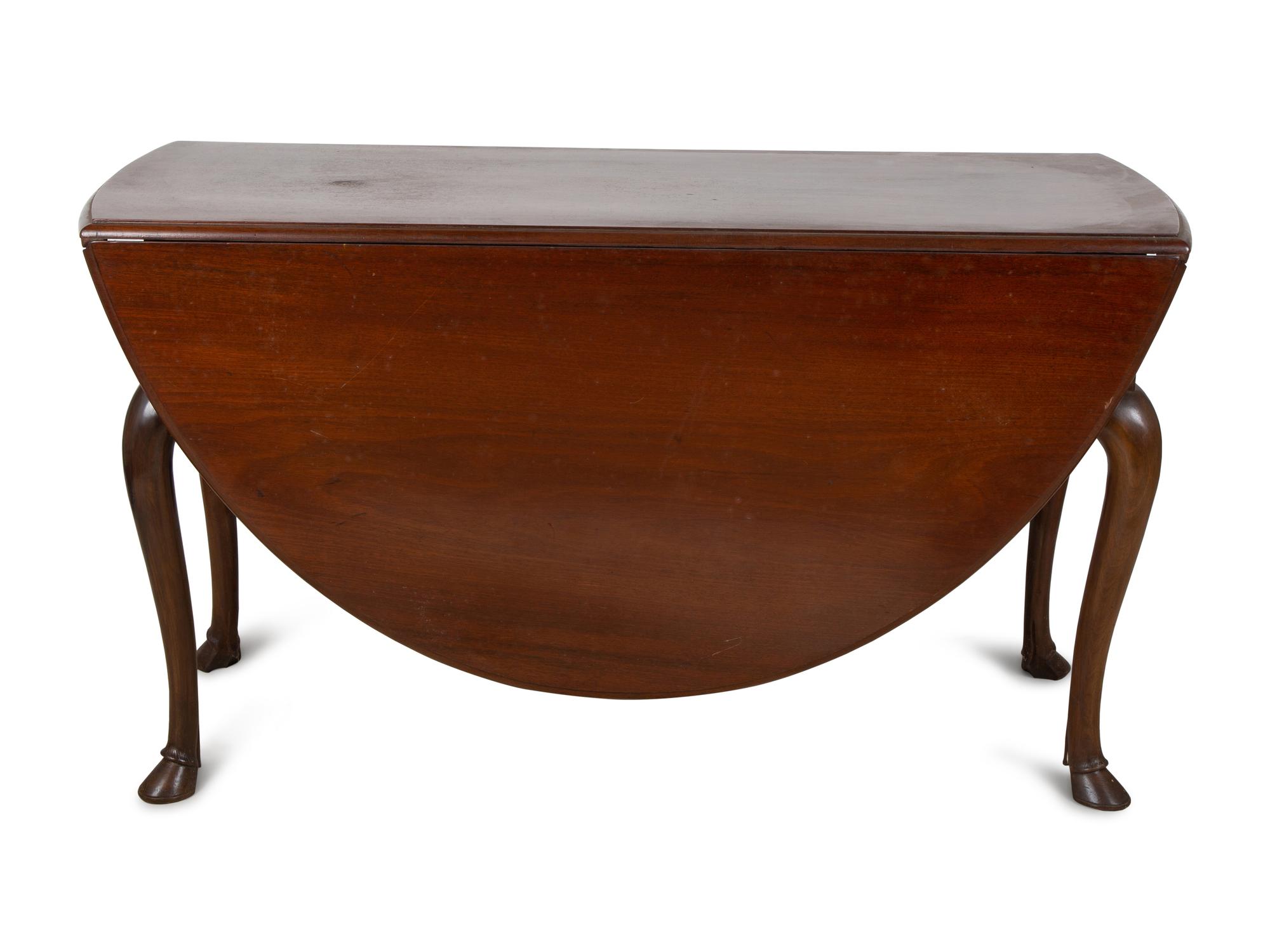 An George III Style Mahogany Drop Leaf Oval Dining Table