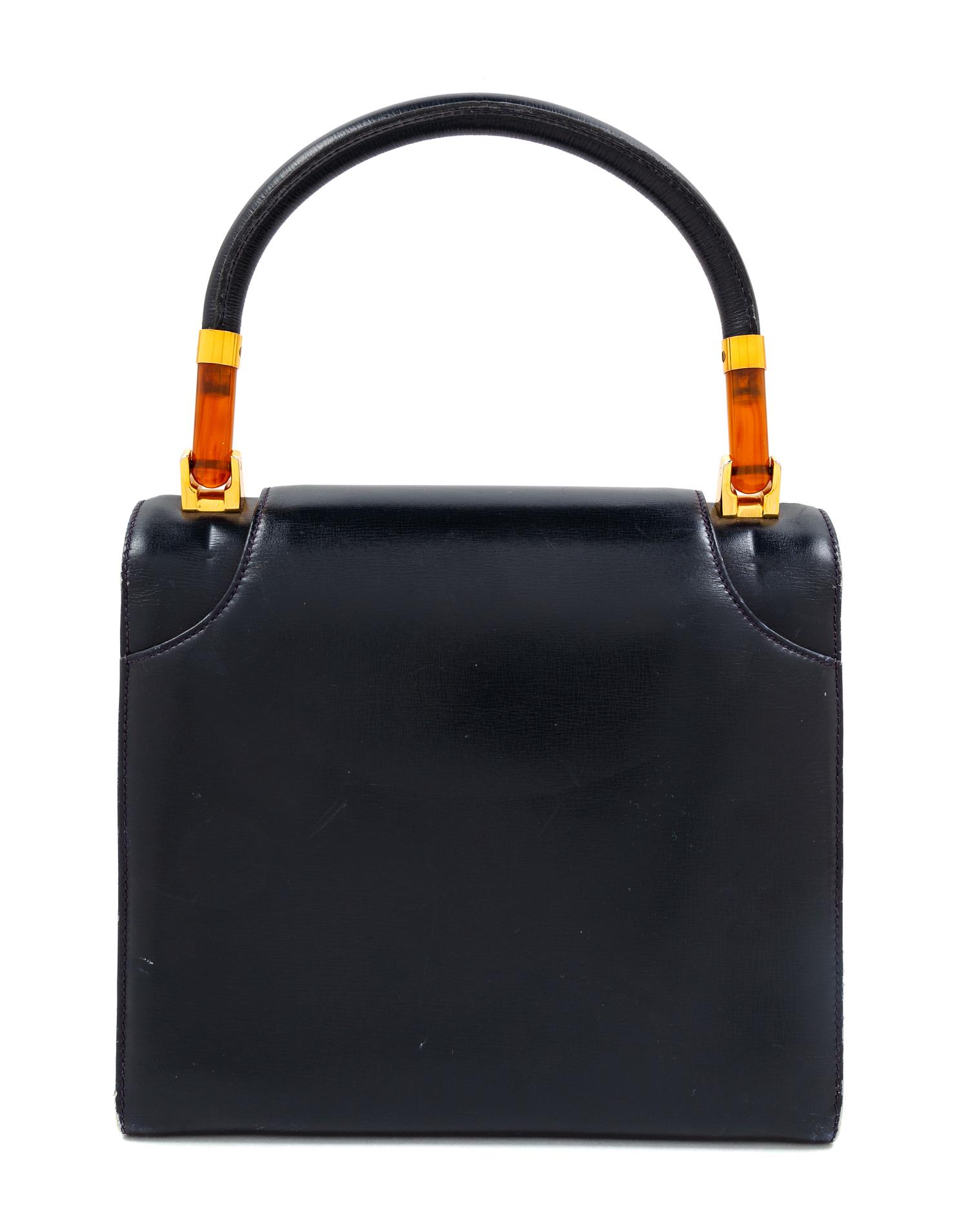 A Gucci Navy Leather Vintage Flap Handbag, 7.25" H x 8" W x 2.75" D; Handle drop: 4".