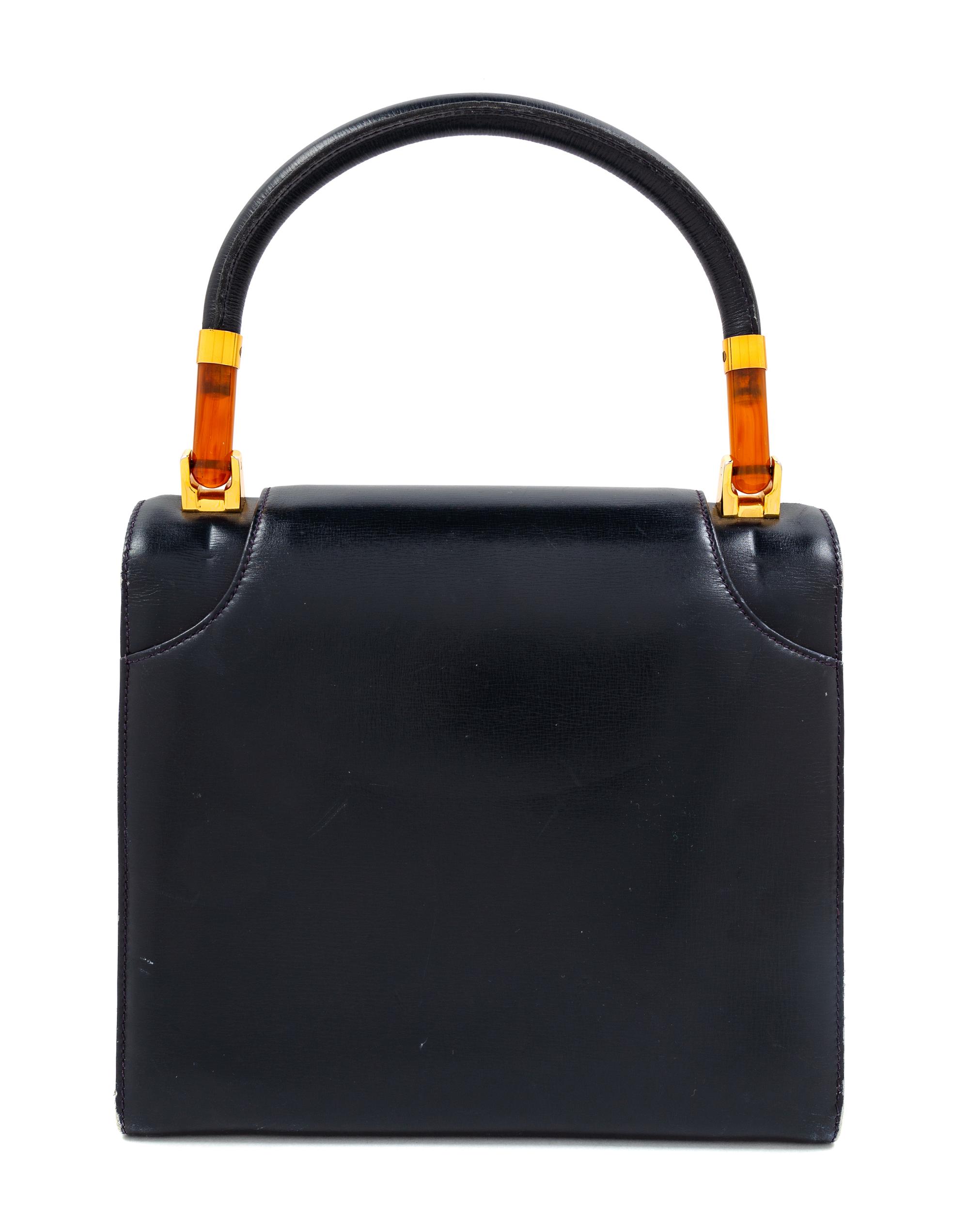 A Gucci Navy Leather Vintage Flap Handbag, 7.25" H x 8" W x 2.75" D; Handle drop: 4".
