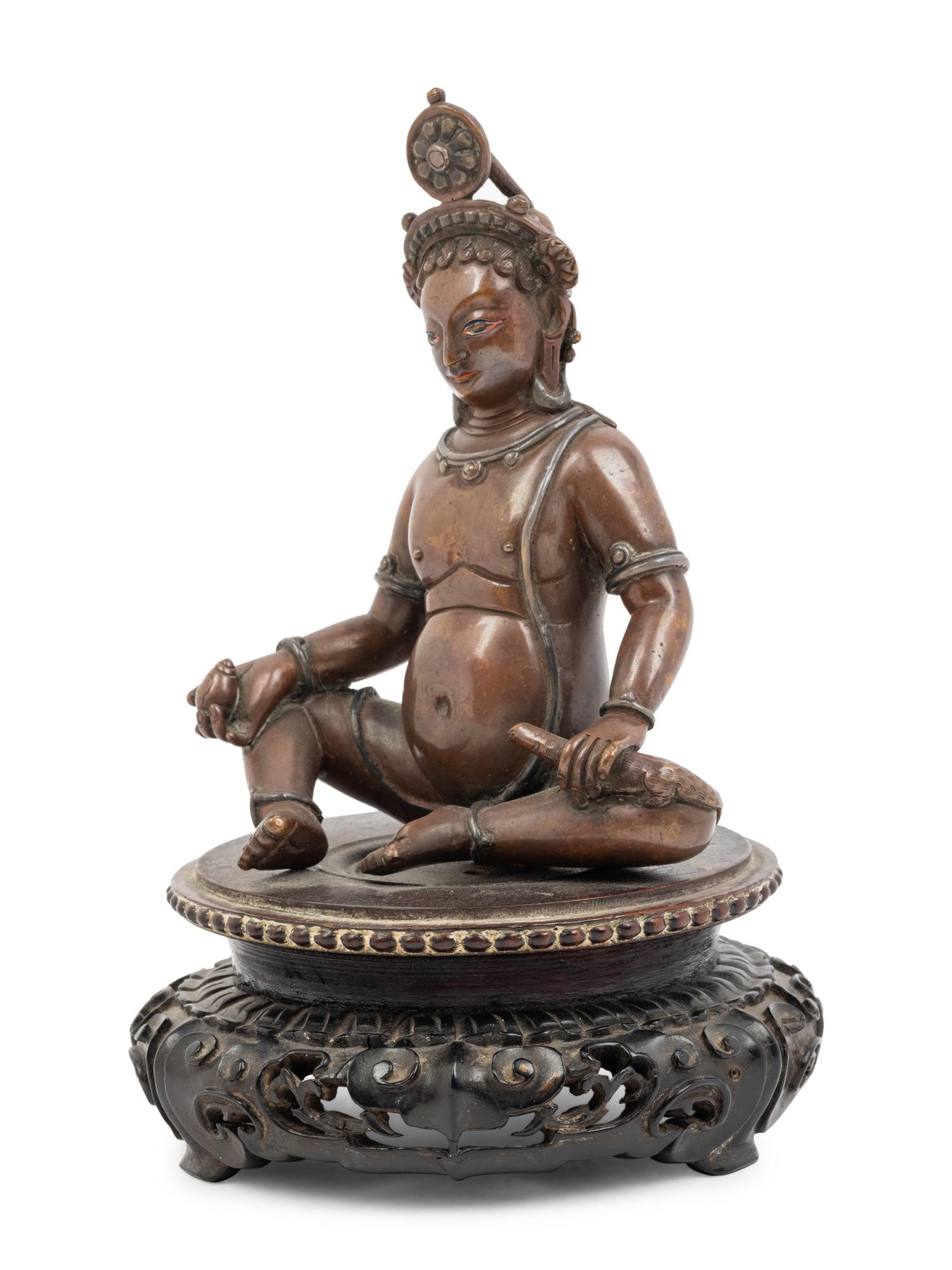 A Nepalese Bronze and Silver Figure of Seated Kubera