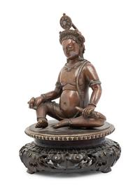 A Nepalese Bronze and Silver Figure of Seated Kubera