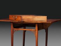 A Late Chippendale Carved Cherrywood Stretcher-Base Pembroke Table