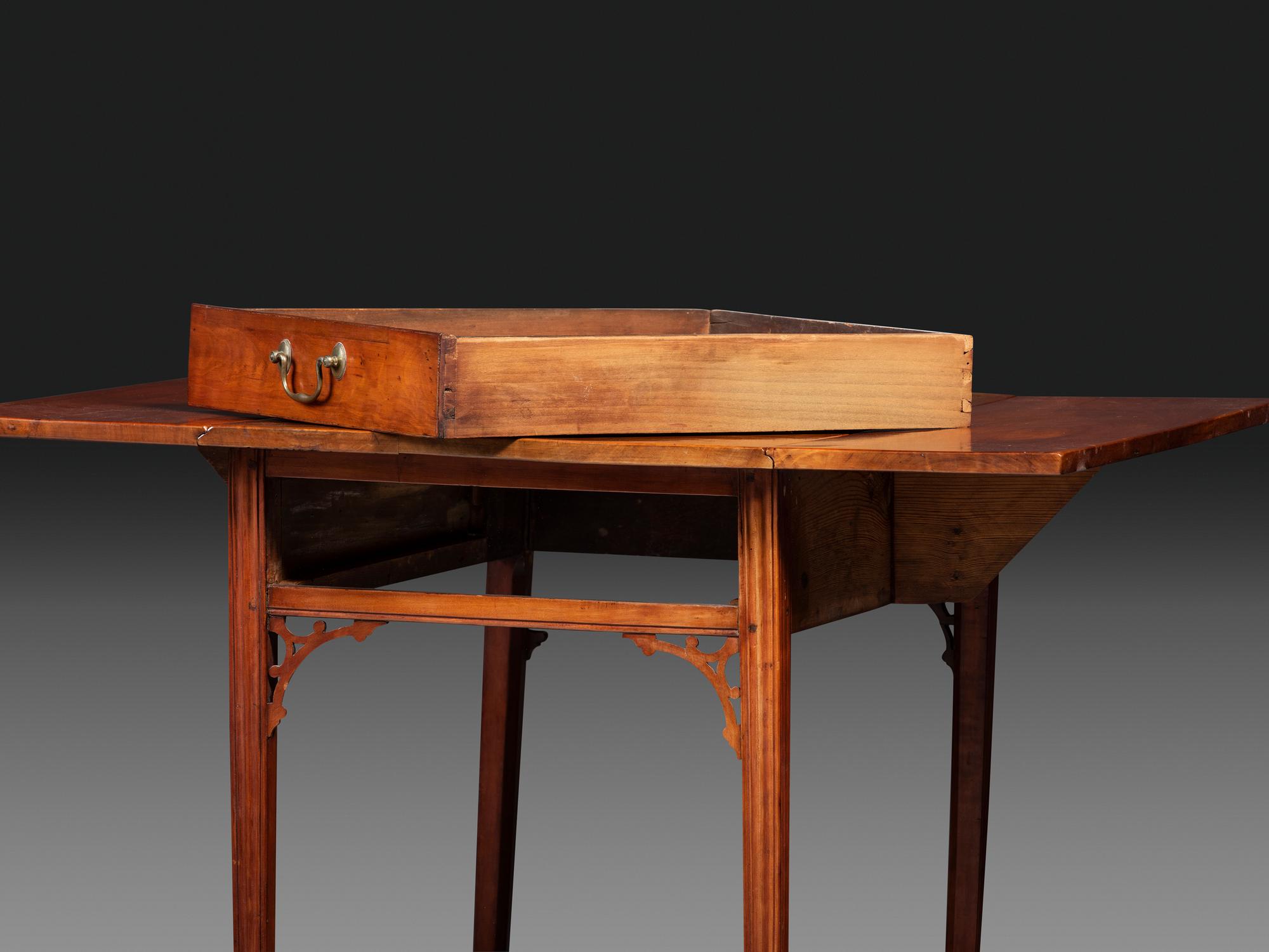 A Late Chippendale Carved Cherrywood Stretcher-Base Pembroke Table