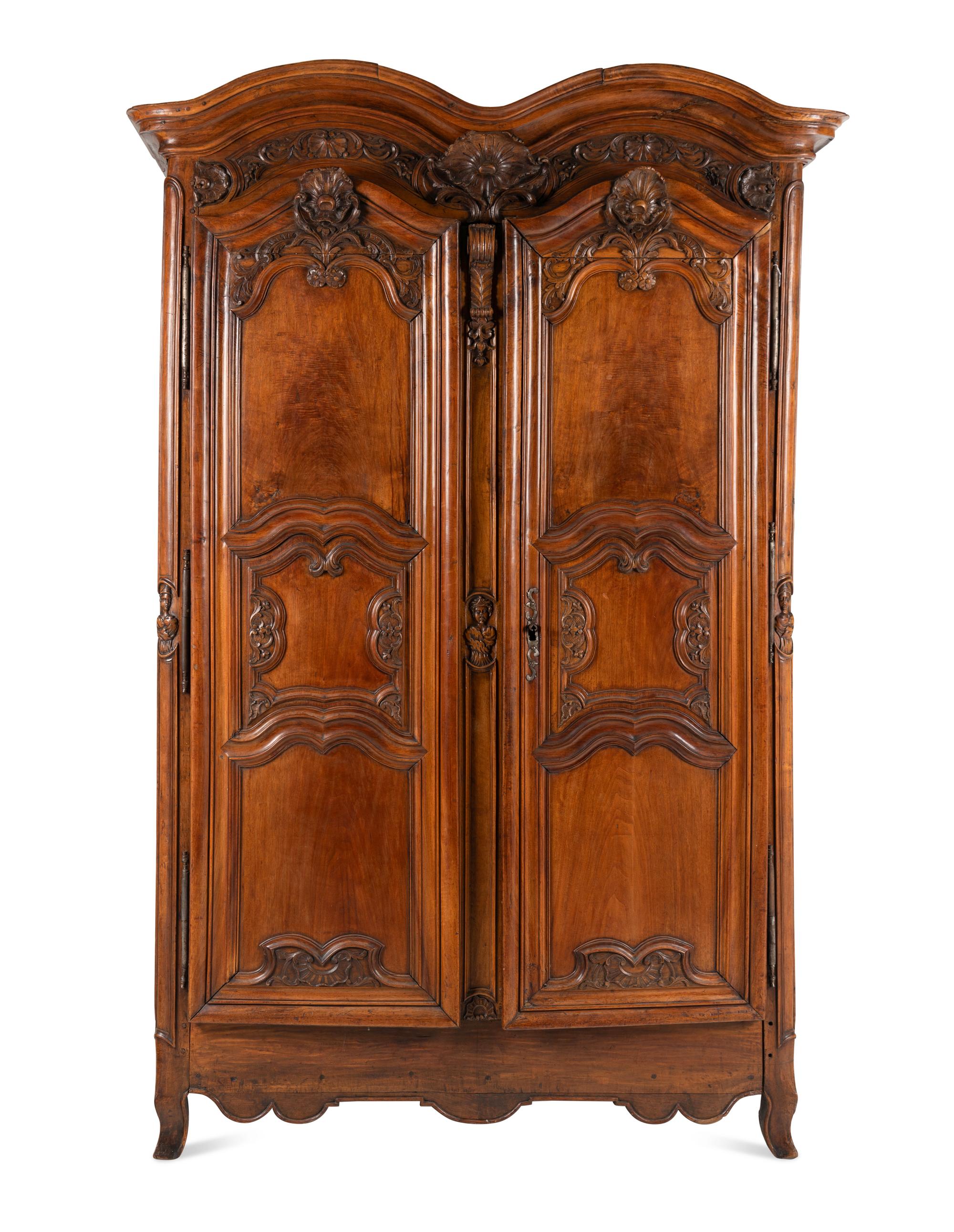 A Louis XV Carved Walnut Armoire
