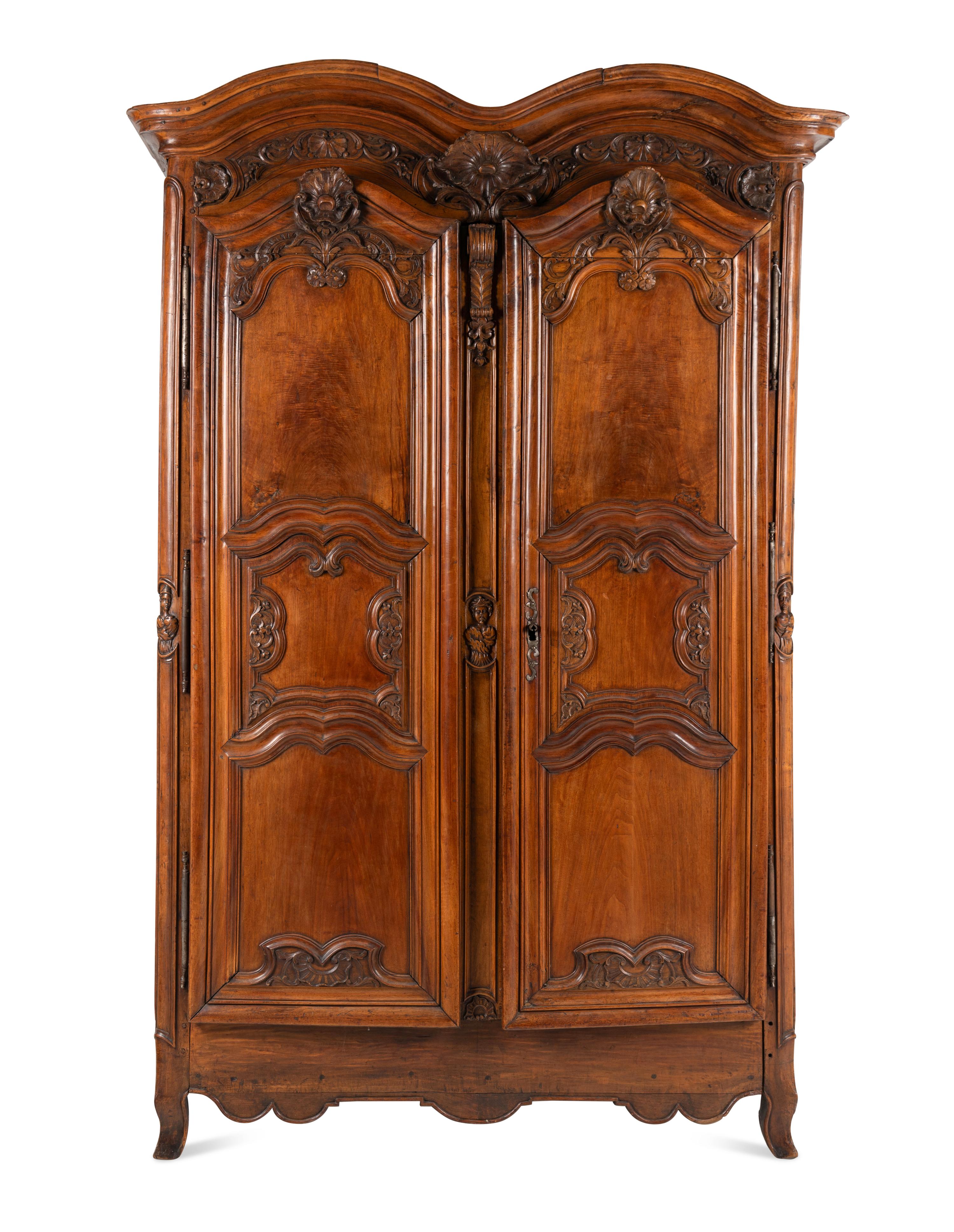A Louis XV Carved Walnut Armoire