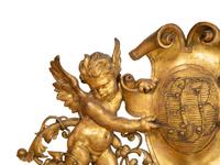 A Continental Carved Giltwood Cherub Wall Plaque