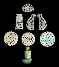Seven Reticulated Jade, Jadeite and Serpentine Pendants Diameter of largest 2 1/4 inches. — 19TH CENTURY