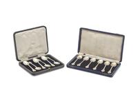 Two Cased Sets of Six George V Britannia Silver Trefid Teaspoons