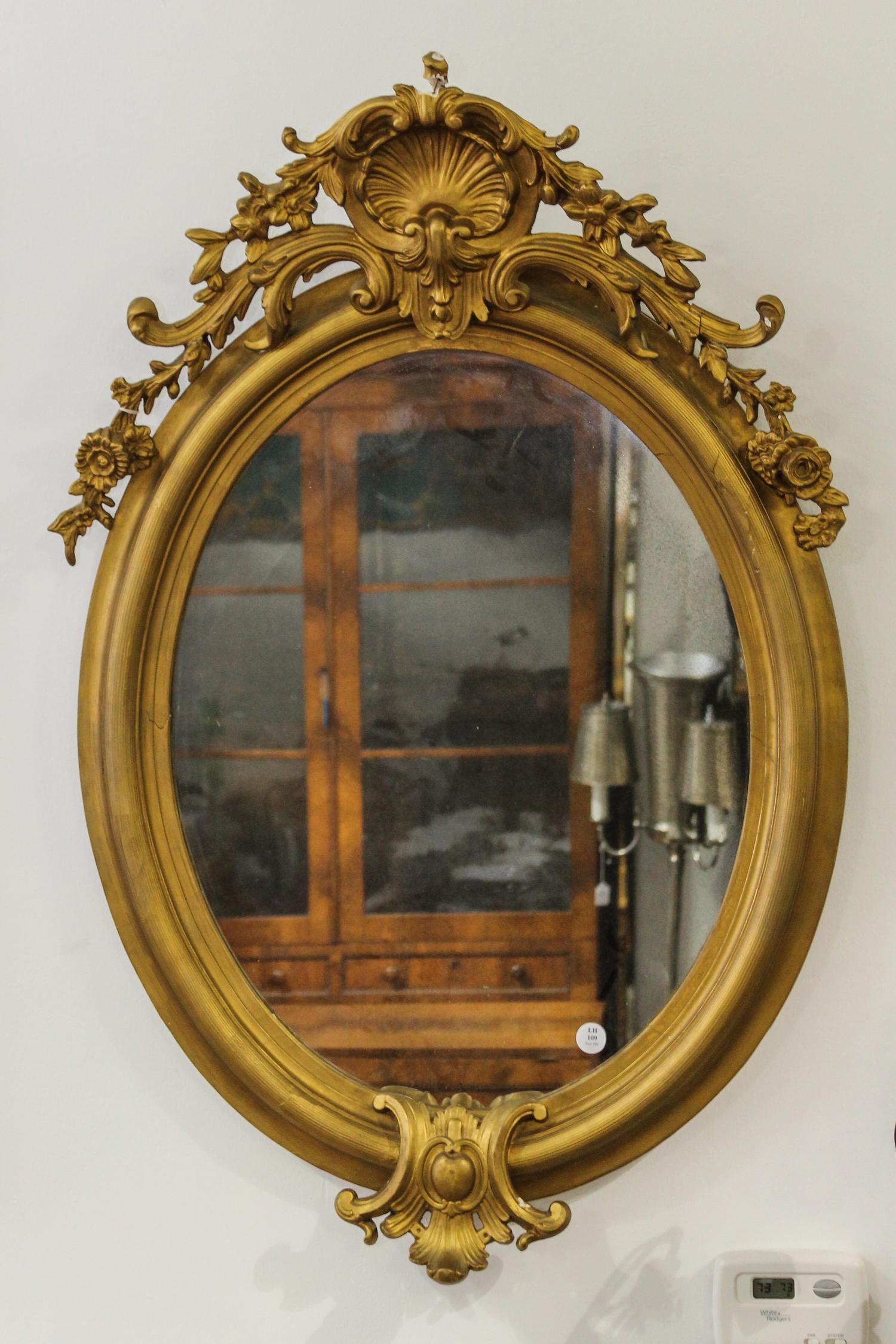 A Napoleon III Giltwood Mirror Height 39 inches. — 19TH CENTURY