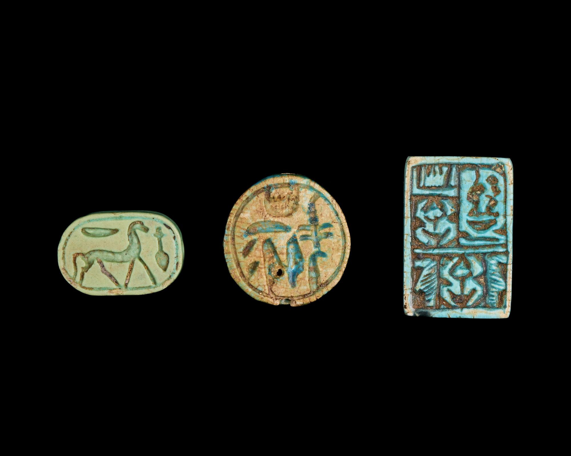 Two Egyptian Faience Seals and an Inscribed Bead