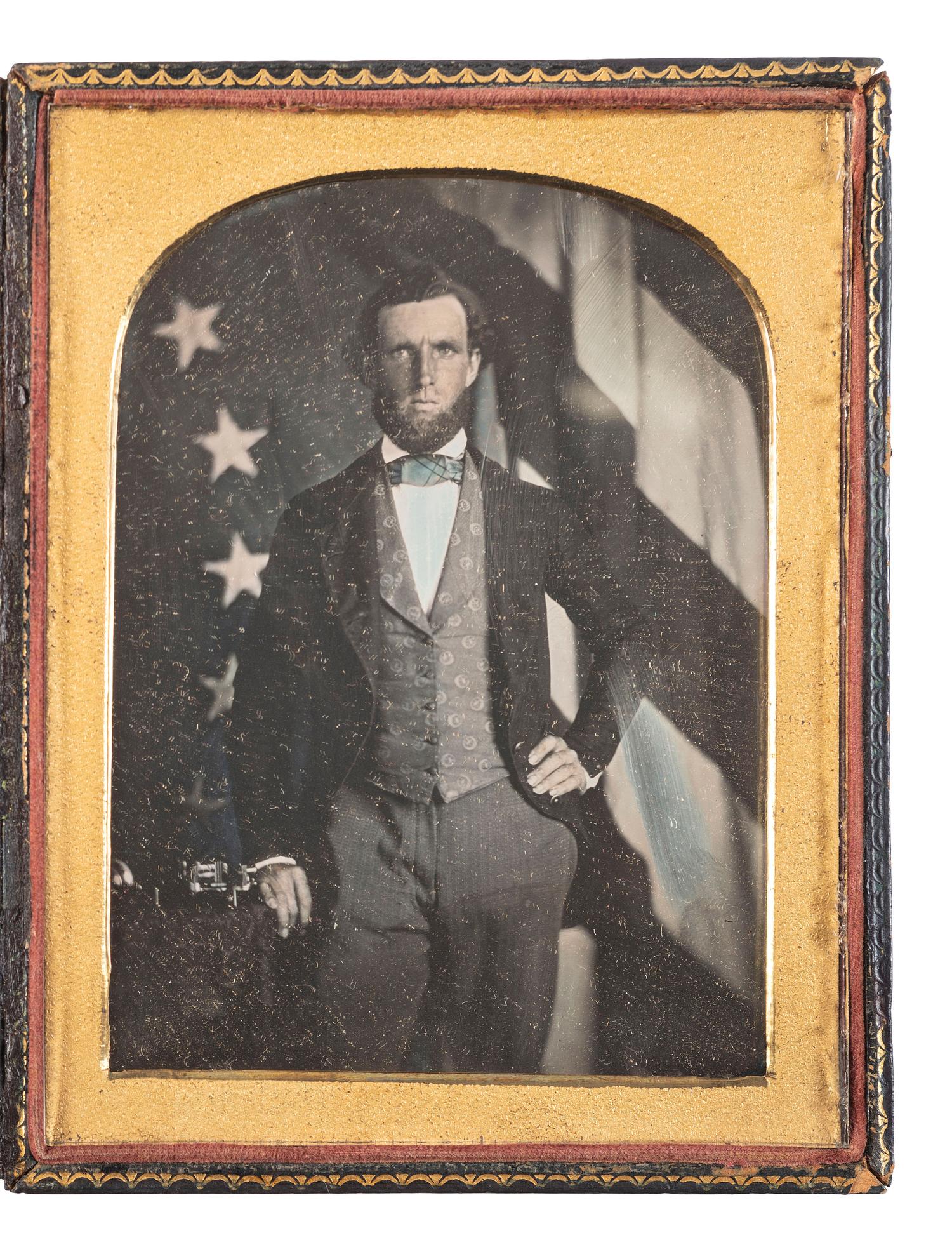 [EARLY PHOTOGRAPHY]. Half plate daguerreotype featuring a telegrapher posed in front of an American flag.