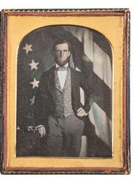 [EARLY PHOTOGRAPHY]. Half plate daguerreotype featuring a telegrapher posed in front of an American flag.