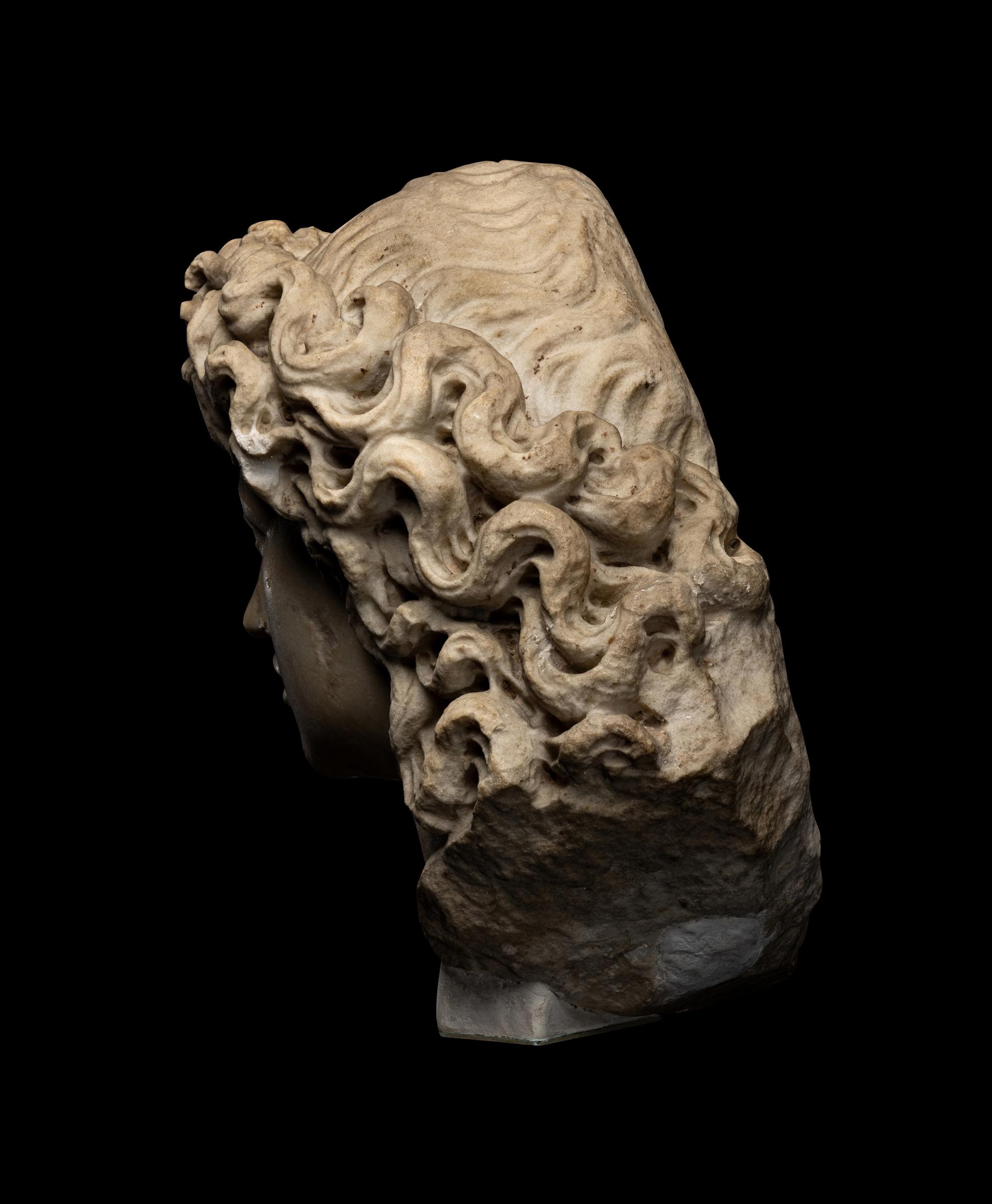 A Roman Marble Head of a Triton