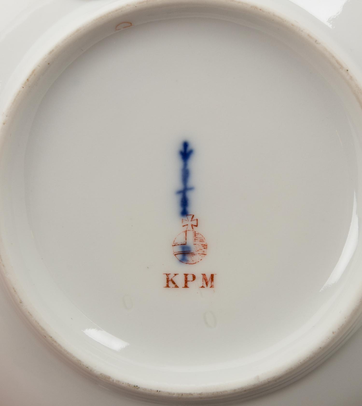 A Set of Four Berlin (K.P.M.) Parcel Gilt Cobalt Ground Porcelain Teacups and Saucers