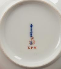 A Set of Four Berlin (K.P.M.) Parcel Gilt Cobalt Ground Porcelain Teacups and Saucers
