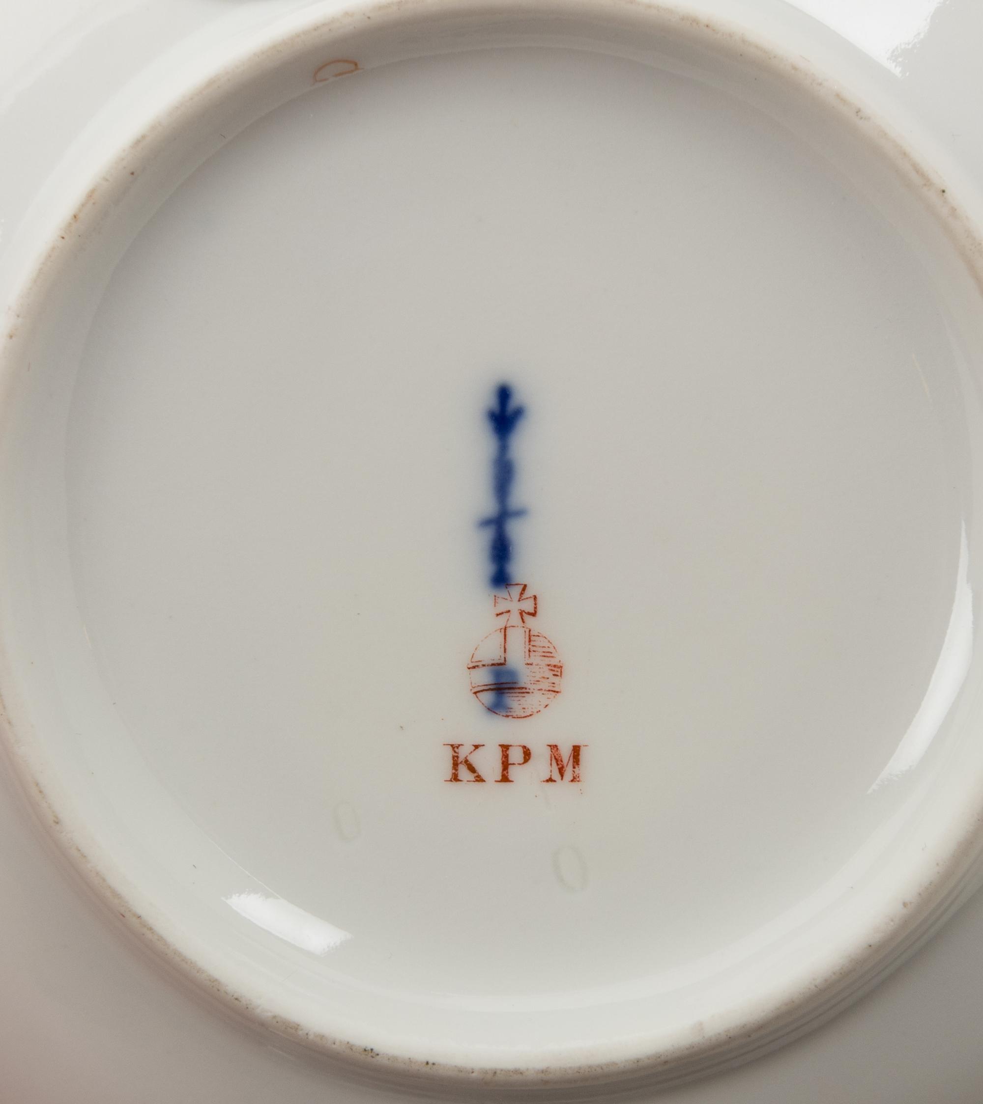 A Set of Four Berlin (K.P.M.) Parcel Gilt Cobalt Ground Porcelain Teacups and Saucers