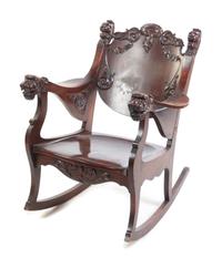 A Cherry Rocking Chair Height 34 1/2 x width 31 x depth 27 1/2 inches. — CIRCA LATE 19TH/EARLY 20TH CENTURY