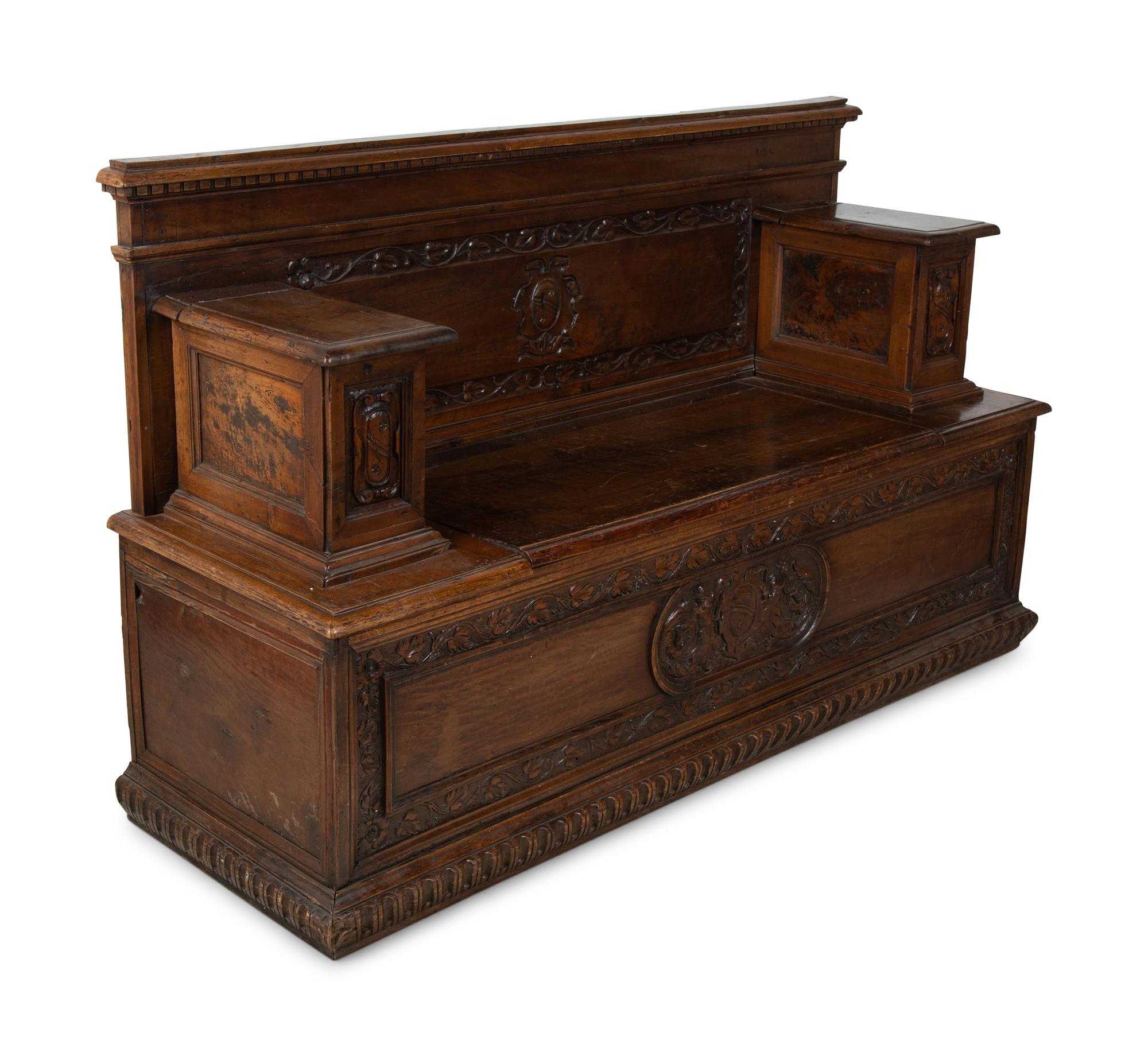An Italian Carved Walnut Cassapanca — 17/18TH CENTURY AND LATER