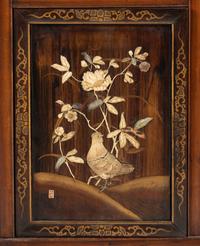 A Victorian Japonesque Carved and Inlaid Cabinet