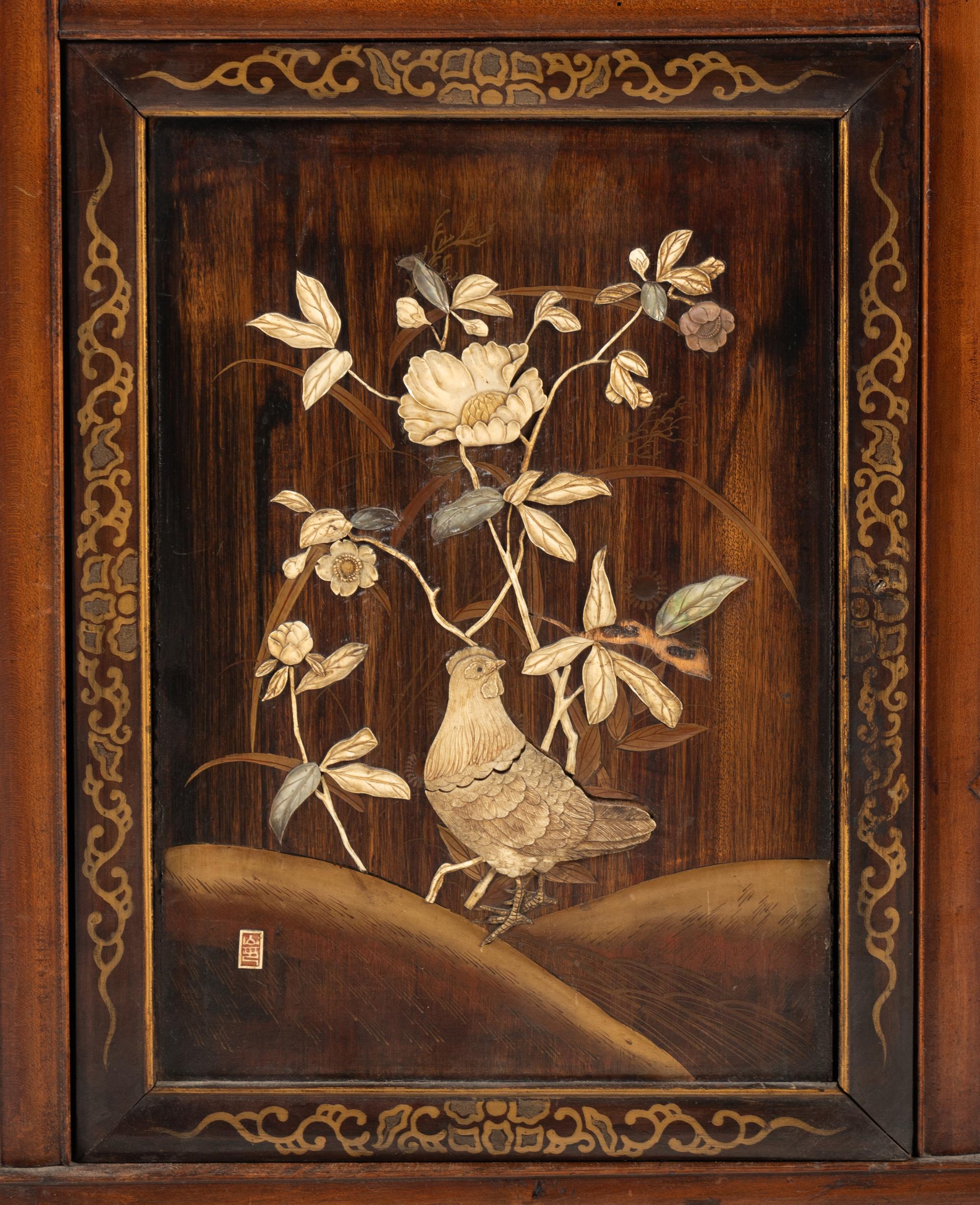 A Victorian Japonesque Carved and Inlaid Cabinet