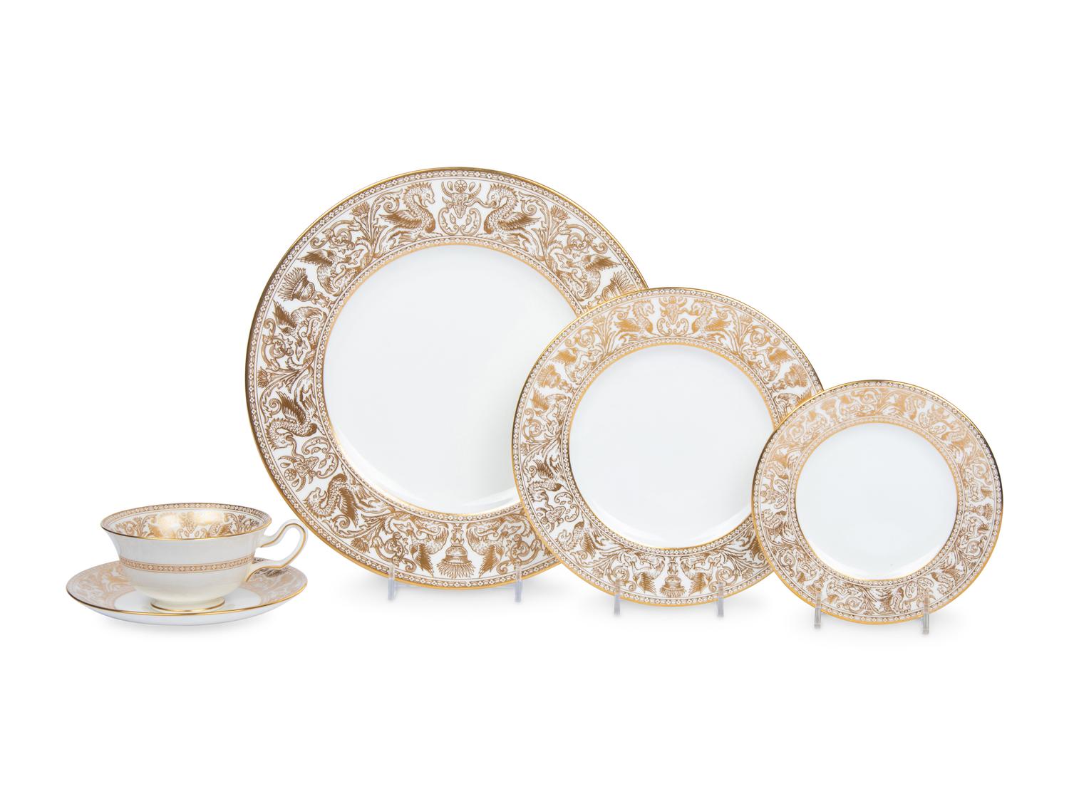 A Wedgwood Gold Florentine Porcelain Dinner Service